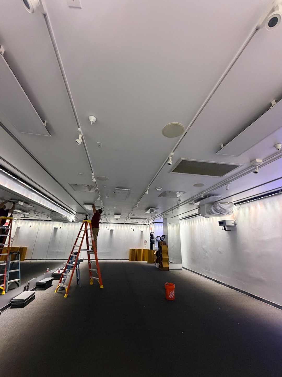 Work in progress: servicing the ceiling-mounted heating panels.